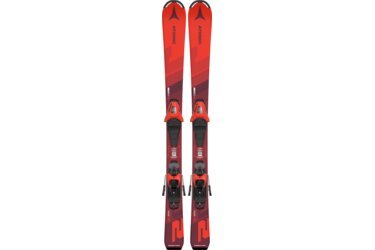 Twee rode Atomic Redster J2 ski's met bindingen