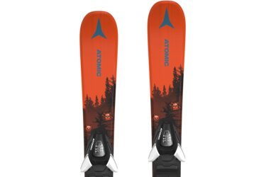 Pair of orange Atomic kids' skis with bindings and forest monster design