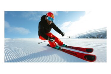 Skier on groomed ski slope
