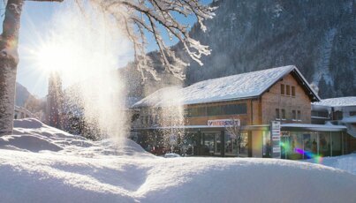 Intersport shop in a valley in a snowy winter landscape